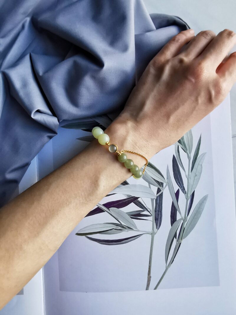 Sagacity bracelet from EBIG Jewel on marble with photo of leaves and cloth